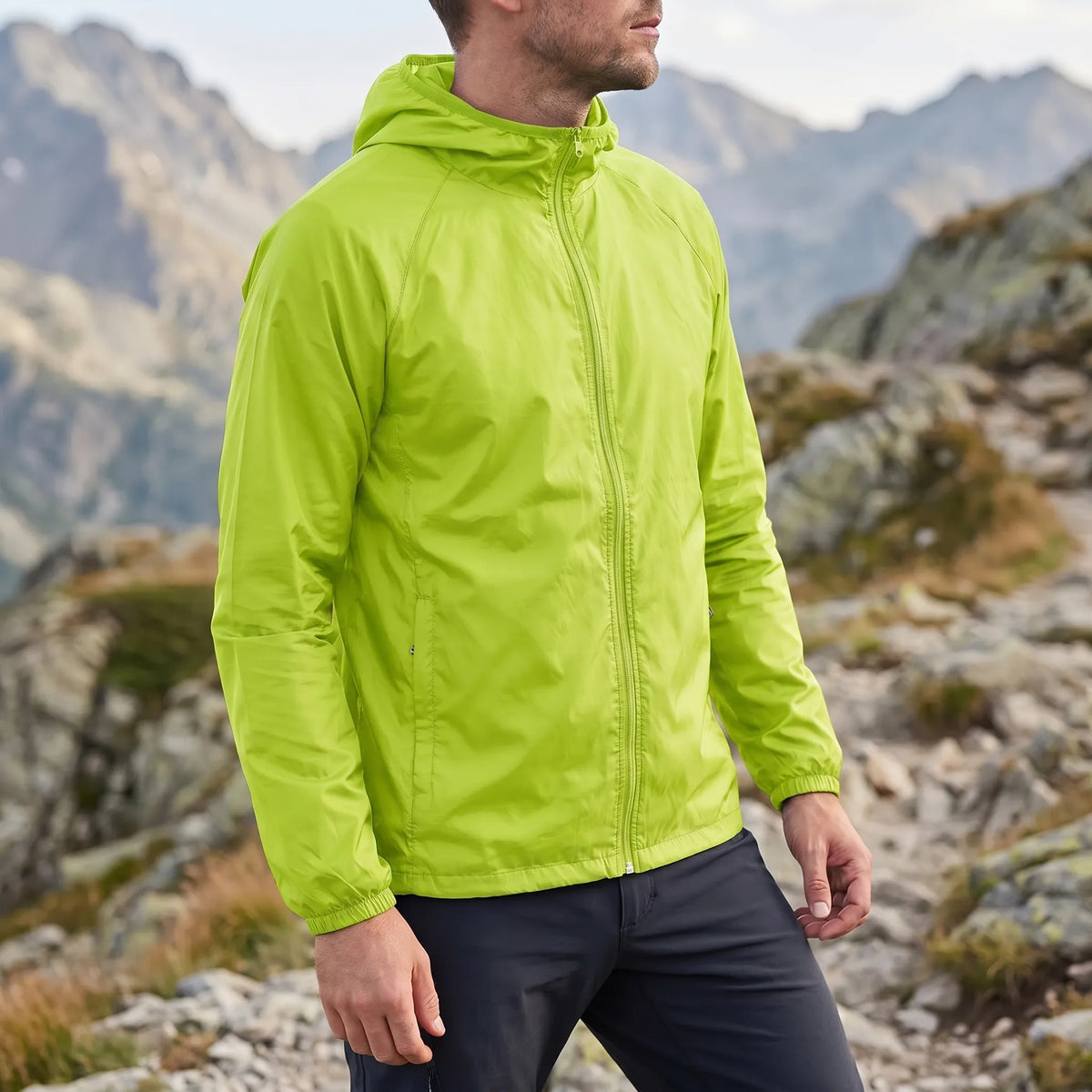 Lightweight packable windbreaker with integrated hood and water-repellent outer