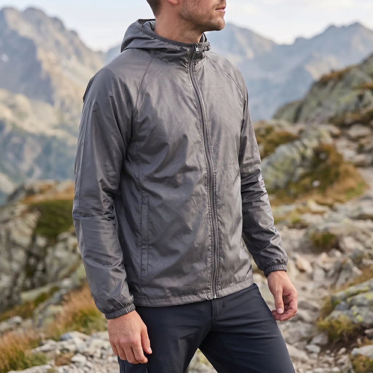 Lightweight packable windbreaker with integrated hood and water-repellent outer