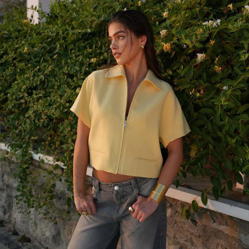 Cropped short sleeve zip-up jacket with structured collar and front pockets